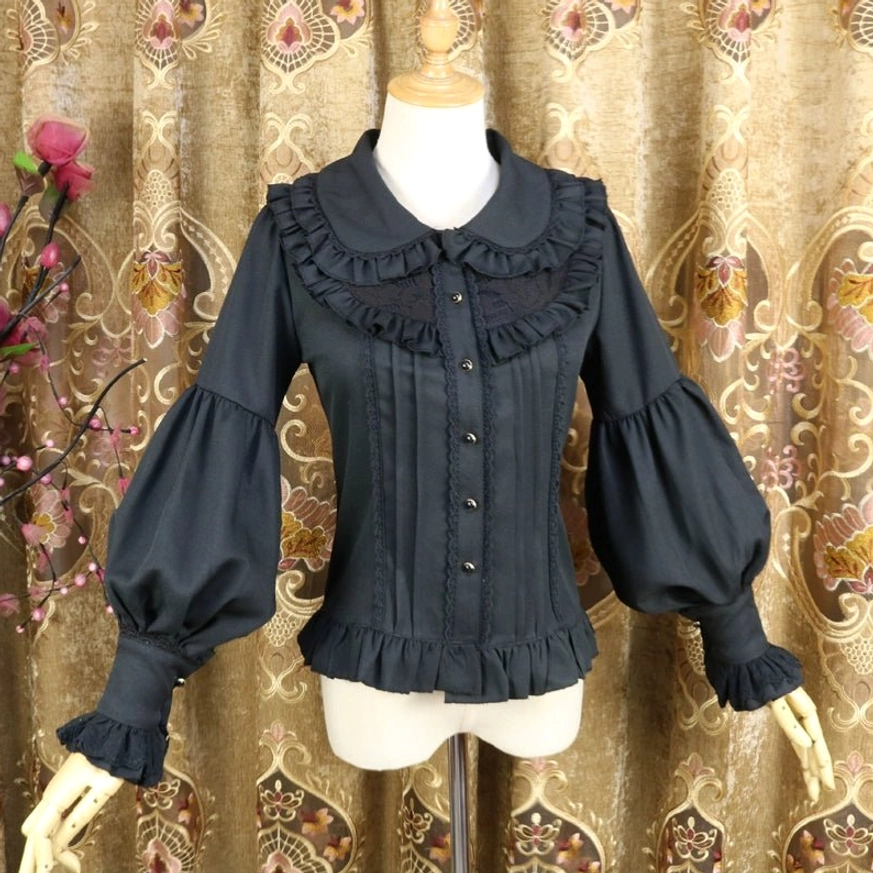 Black classic Lolita Peter Pan collar blouse featuring lantern sleeves, ruffled trims, front button placket with pleated details, three-quarter angle