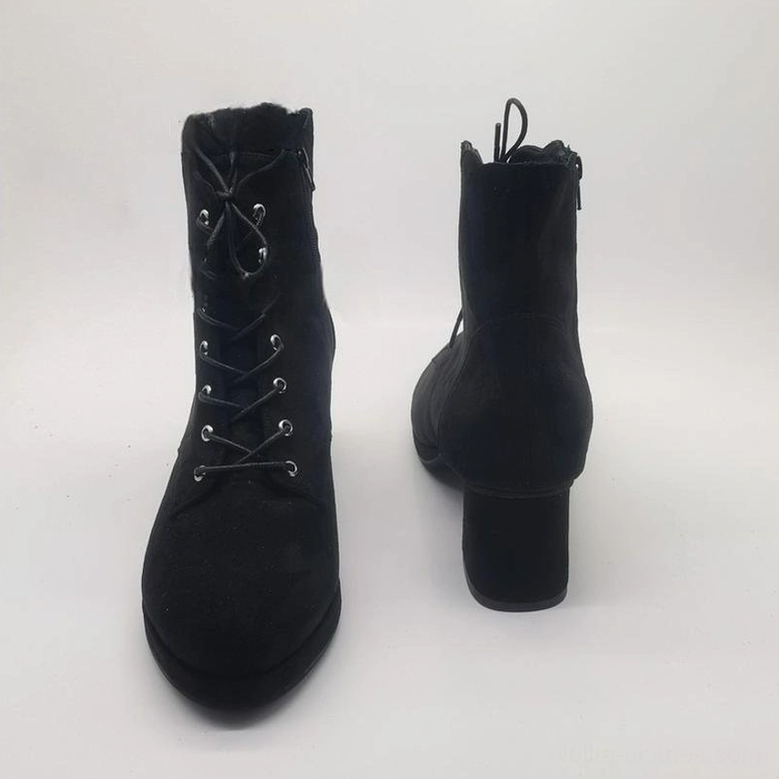 Combined front and rear view of paired black Lolita suede boots showcasing chunky block heel structure, side zipper closure on heel-side boot, and petal-shaped collar design
