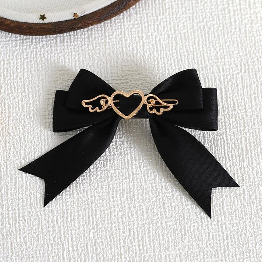 Black lolita bow hair clip brooch with gold heart-wing charm perfect for gothic lolita coordinates