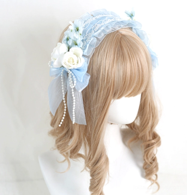 Black lolita floral headband with gothic aesthetic showing intricate lace work and artificial flower arrangements