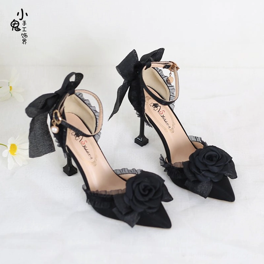 Black matte Lolita camellia bow high heels with pointed toe mesh bow pearl pendant and fabric rose decoration front three quarter