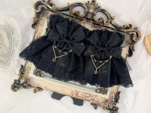 black-double-layer-lace-lolita-wrist-cuffs-embroidered-lace-gold-star-pendant-chain-ruffled-hem-detail-view