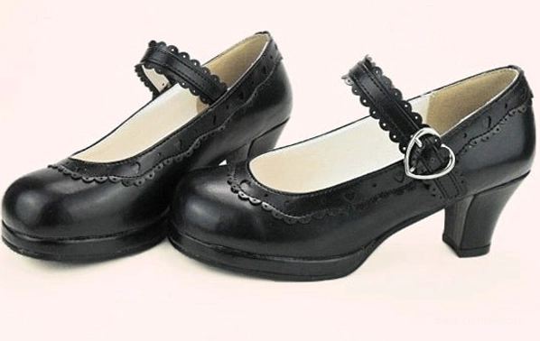 Black lolita mary jane heel shoes three-quarter side view with heart buckle and scalloped details