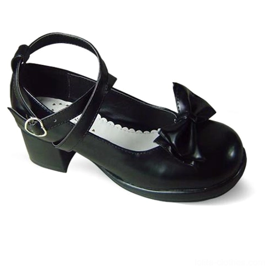 Side view flat lay of black matte sweet Lolita Mary Jane platform shoe showing crisscross straps, bow details, metal buckle, and scalloped collar