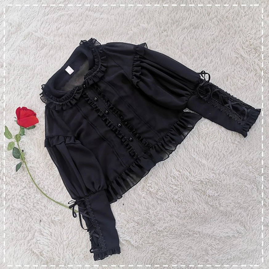 Black lolita mutton sleeve blouse with ruffled collar and chiffon fabric flat lay view