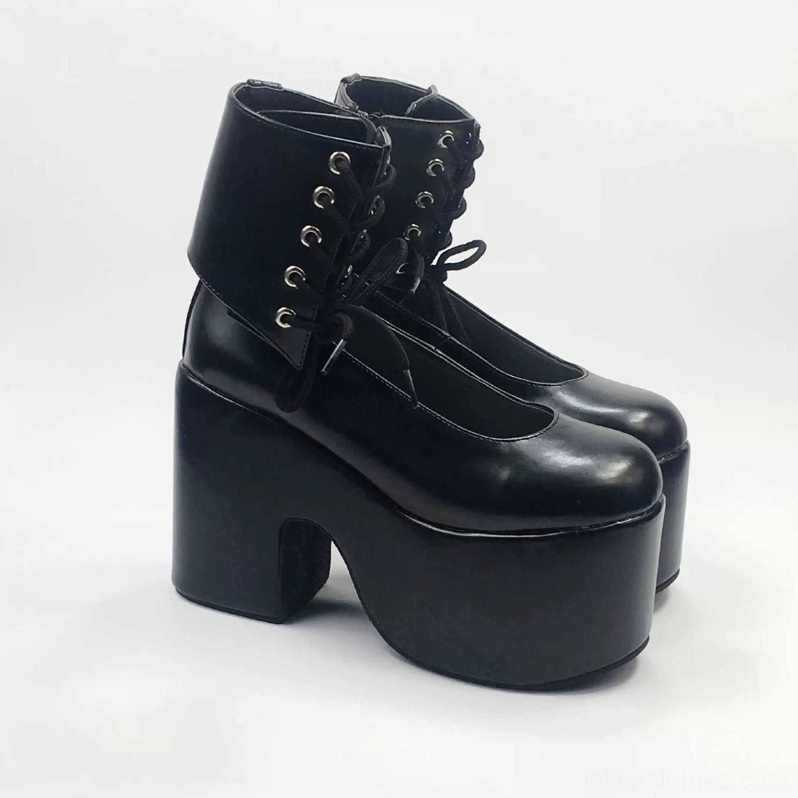 Black lolita platform Mary Jane ankle boots with glossy leather, metal lace eyelets, decorative tie-up ankle collar and thick platform sole block heel, three-quarter view
