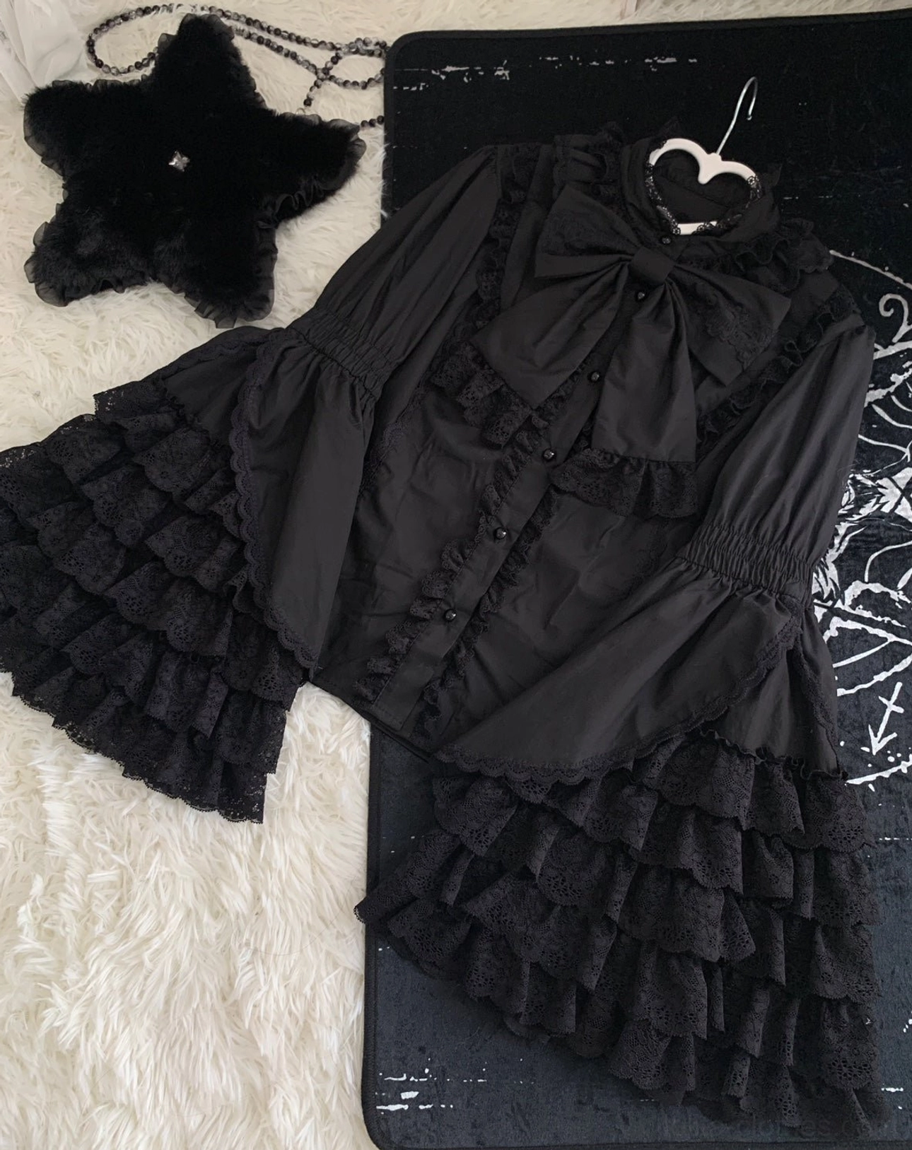 Black Lolita princess blouse back view showing ruffled collar and bell sleeve silhouette