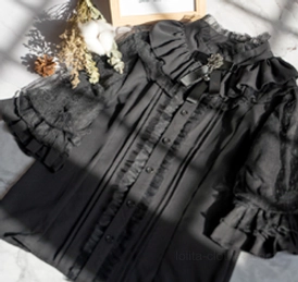 Black ruffled lolita inner blouse close-up flat lay with dry flowers decorative greeting card short sleeve lantern cuff