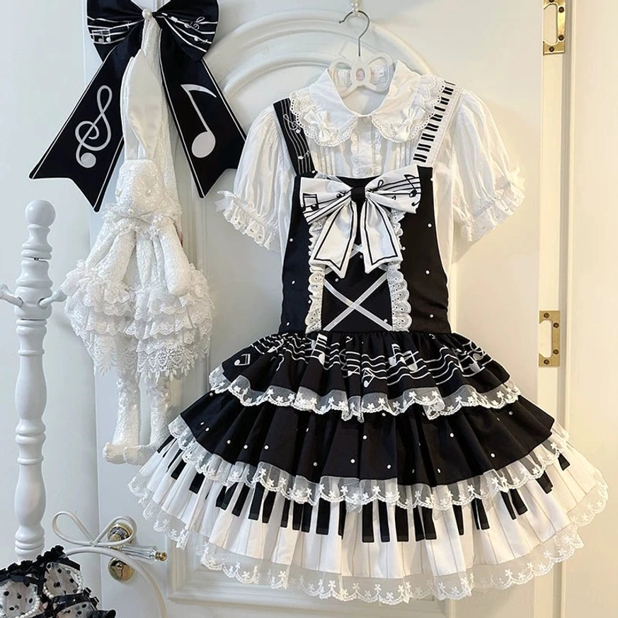 Black Lolita Salopette Dress with Cross Strap Design and Musical Note Skirt Details - Direct Front View with White Bow and Accessories Display