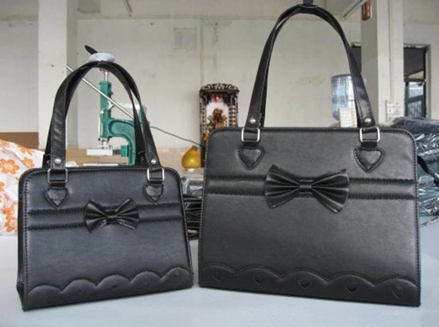 Black lolita shoulder bag full bow ornament scalloped wave bottom trim factory workshop display