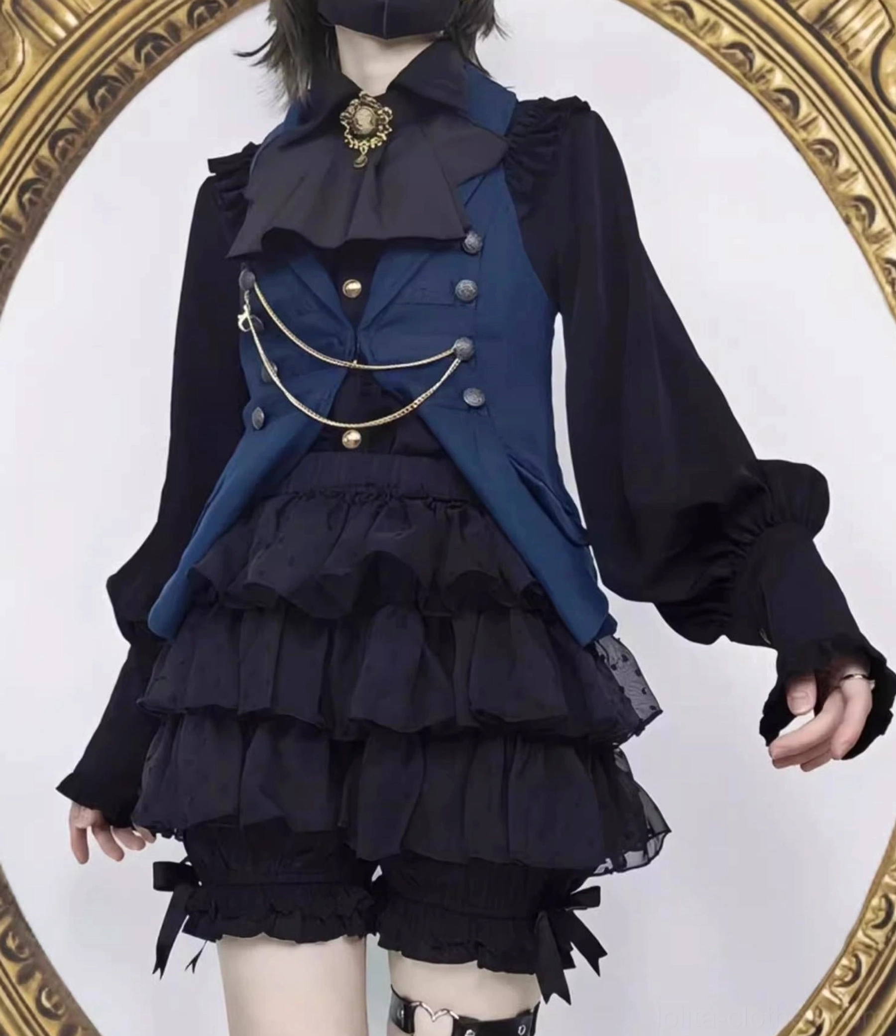 Black lolita tiered ruffle bloomers paired with classic lolita dress coordinate featuring sophisticated jewel tone colors elegant styling and refined aesthetic arrangement