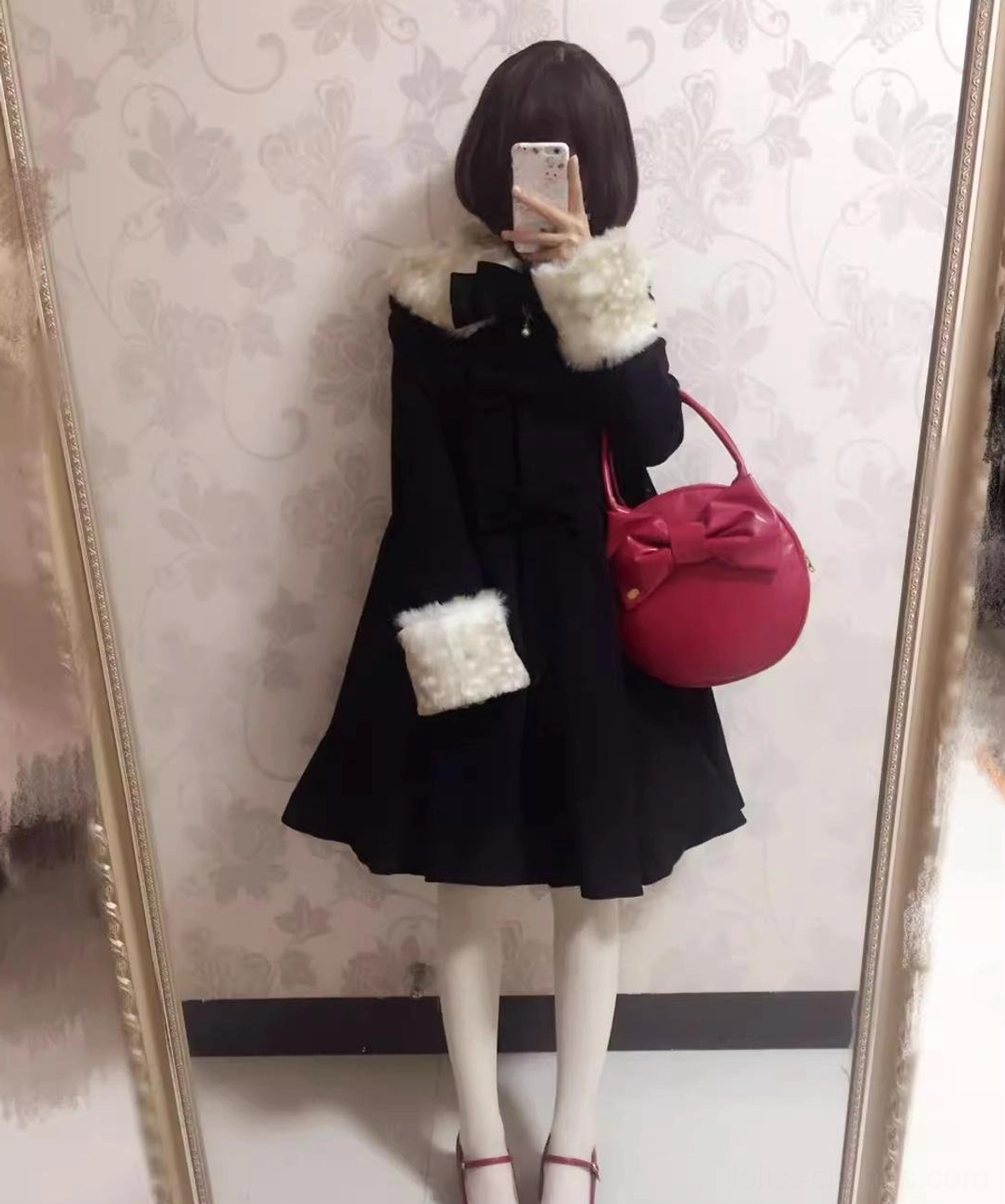 Black wool lolita coat full-body mirror selfie view faux fur collar and cuffs front chest bow pink handbag