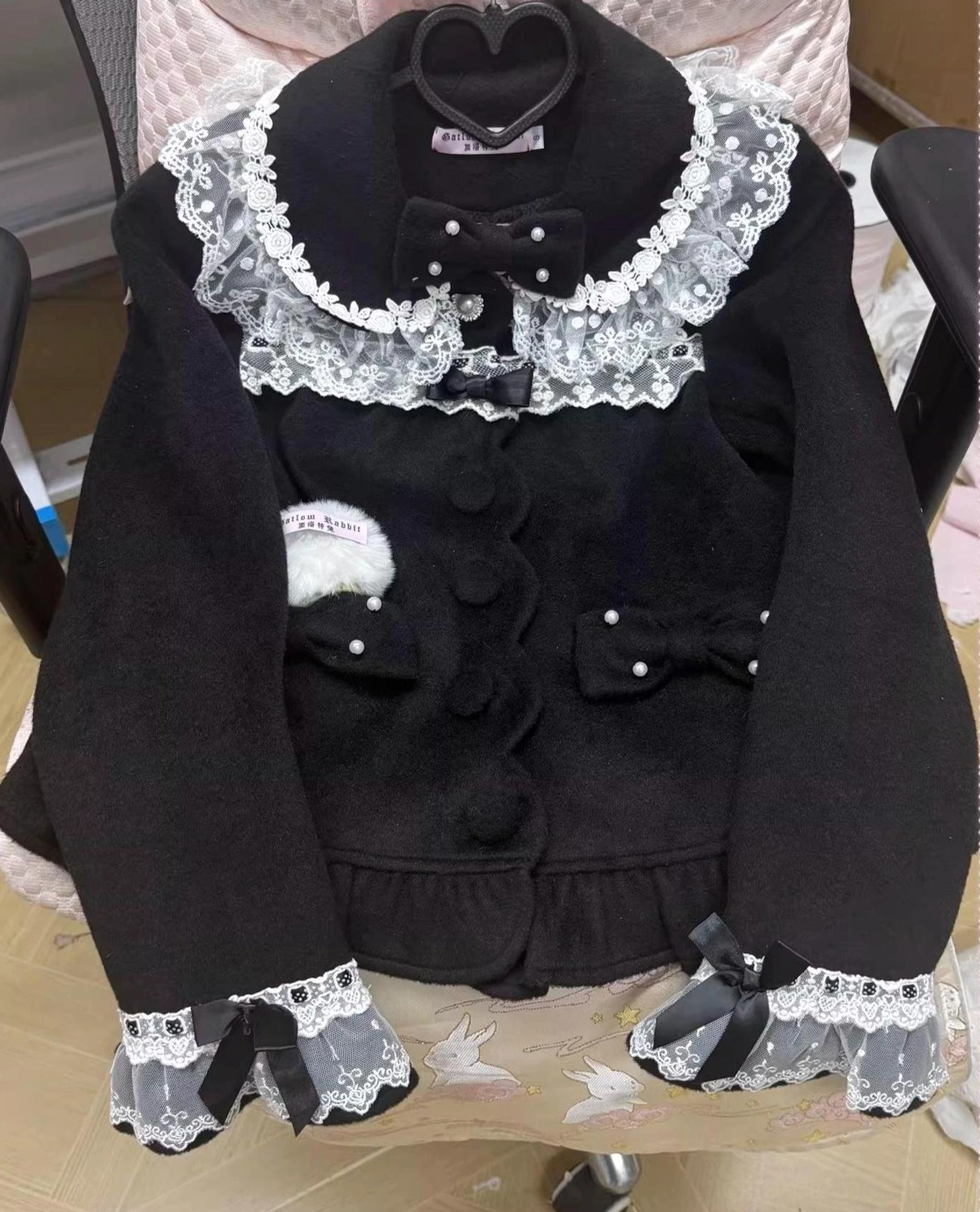 Black classic lolita wool coat front display with lace peter pan collar detachable bow ruffled hem and lace-trimmed cuffs