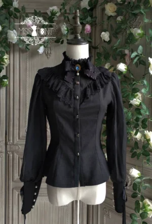 Black vintage mutton sleeve lolita blouse with pearl cuffs and lace collar front view on dress form