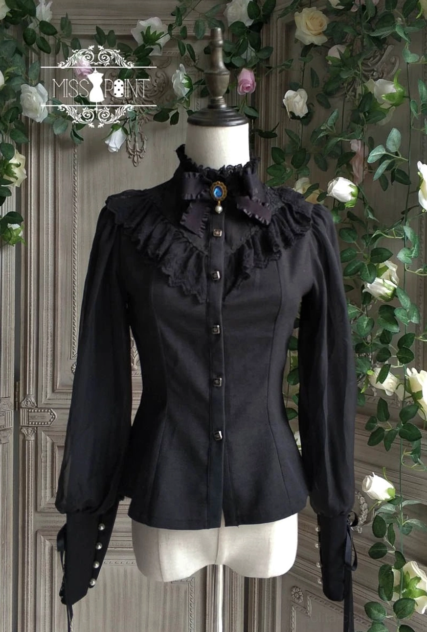Black vintage mutton sleeve lolita blouse with pearl cuffs and lace collar front view on dress form