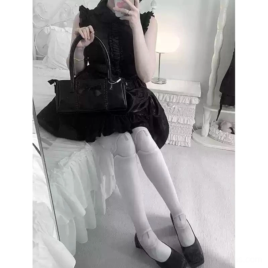 Black nurse Lolita dress joint printed stockings wine red shoes lying bed top-down view
