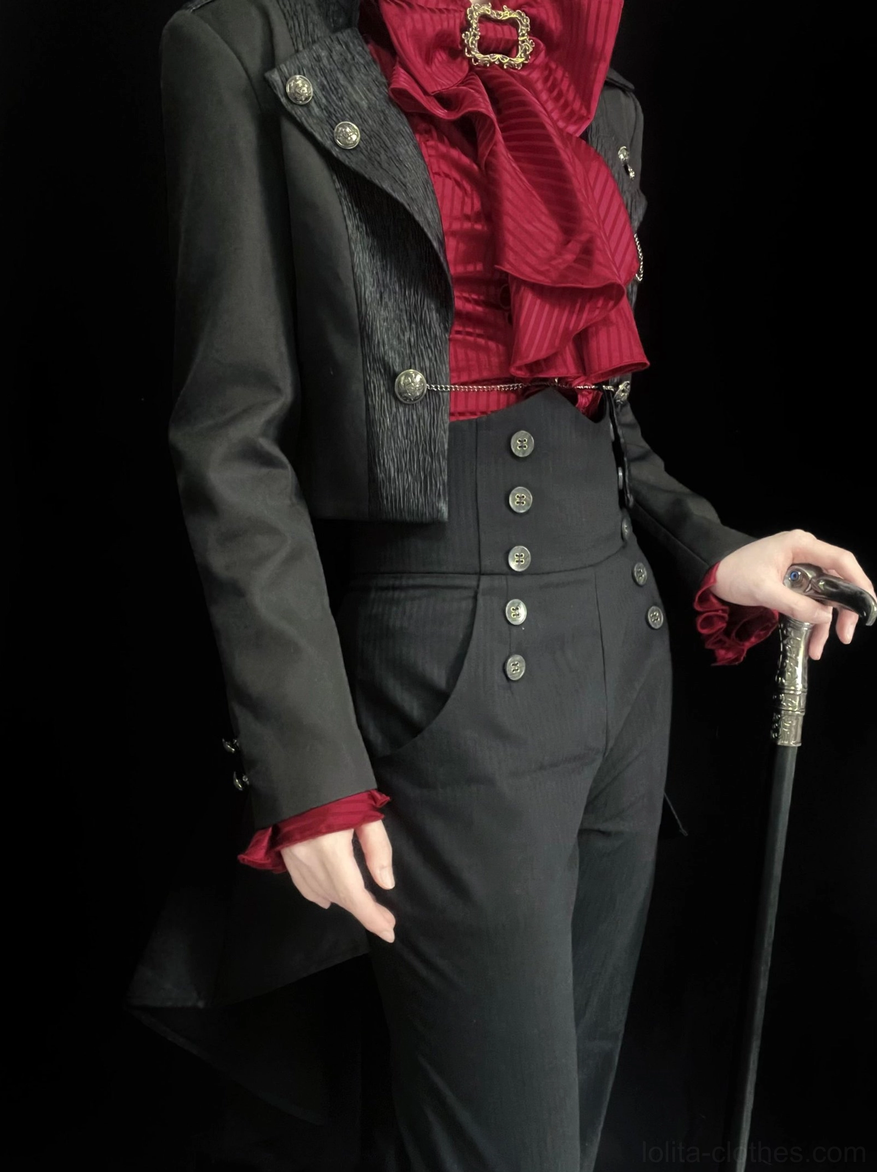 Close-up tailored torso detail of black Ouji Lolita open front coat showing precision blazer construction, fitted waist design, and front button placket with chain decoration