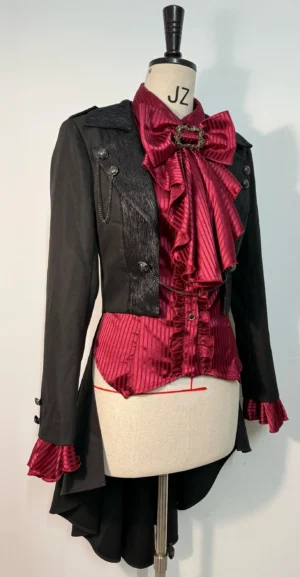 Close-up front torso display of black Ouji Lolita short coat featuring tailored blazer construction, removable train detail, and elegant open front styling on professional model