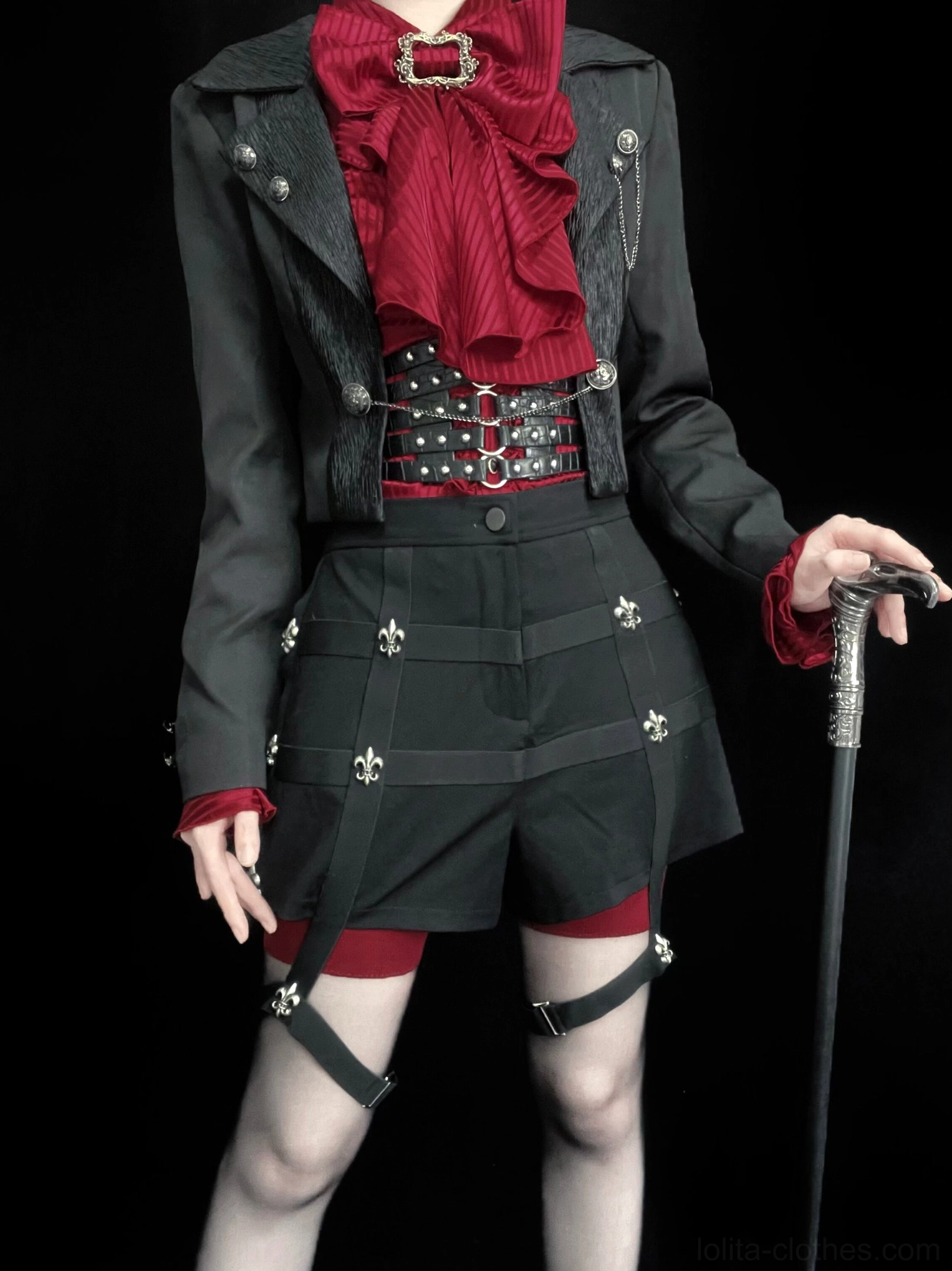 Detailed showcase of black Ouji Lolita coat's removable train feature with studded accessories and formal styling, front torso professional photography