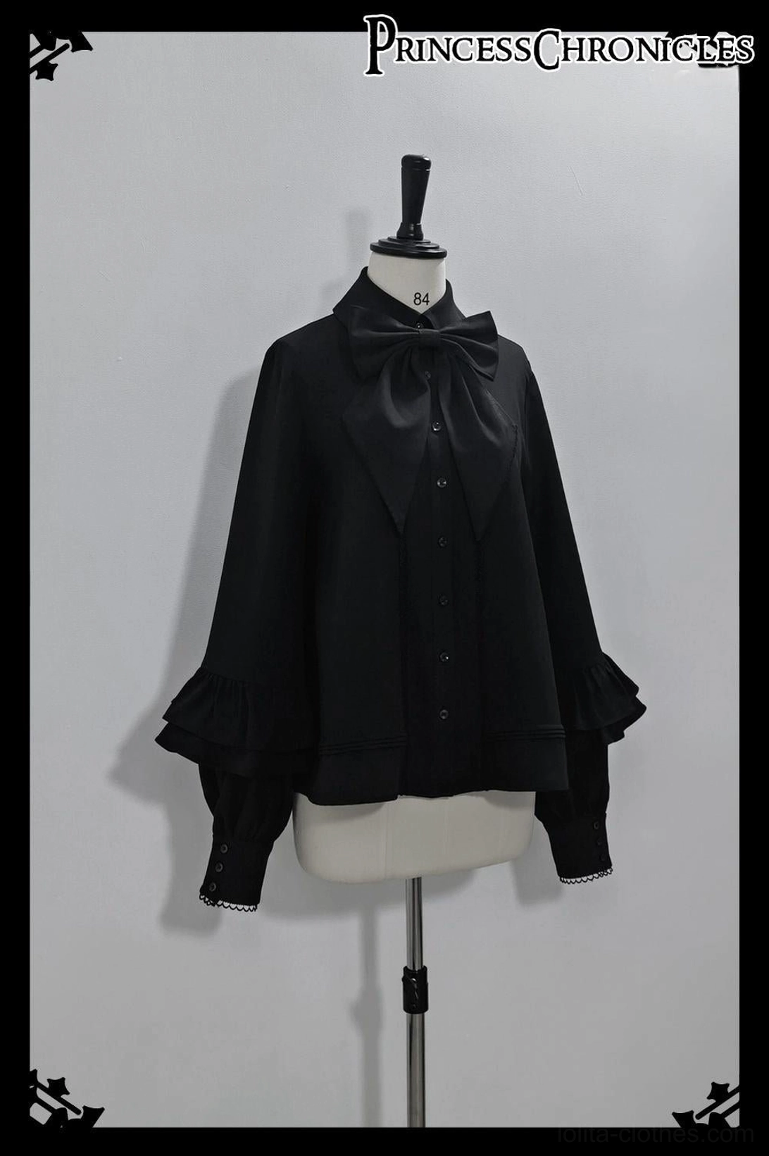 Black Ouji Lolita shirt flared bishop sleeves detail view showcasing tiered ruffles, quality stitching, matte fabric texture, and authentic prince lolita design craftsmanship