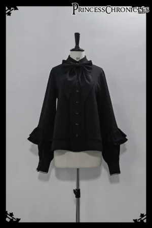 Black Ouji Lolita shirt front view on mannequin featuring detachable large bow tie, flared bishop sleeves with tiered ruffles, front button placket, and matte smooth fabric perfect for prince lolita coordinates