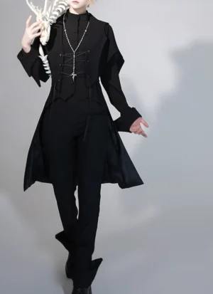 Black swallowtail Ouji Lolita tailcoat vest worn by blonde male model in full-body studio setting with grey background, paired with formal black trousers and cross pendant necklace