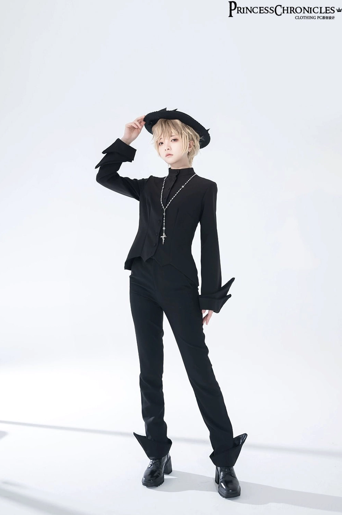 Ouji Lolita fashion subculture styling concept featuring black swallowtail long vest as centerpiece for androgynous alternative fashion and prince persona aesthetic expression