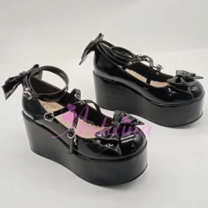 Black patent leather Lolita platform shoes with decorative toe bow and heart-shaped ankle buckles, flat lay front view on white background showcasing high waterproof platform sole