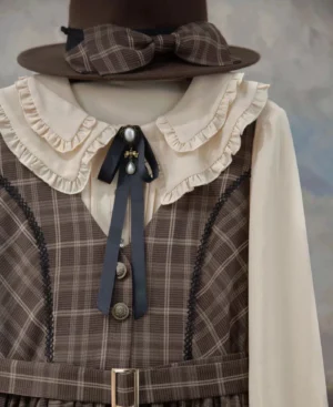 Black pearl pendant daily Lolita bow tie styled on a brown plaid vintage academia Lolita dress with cream ruffled collar