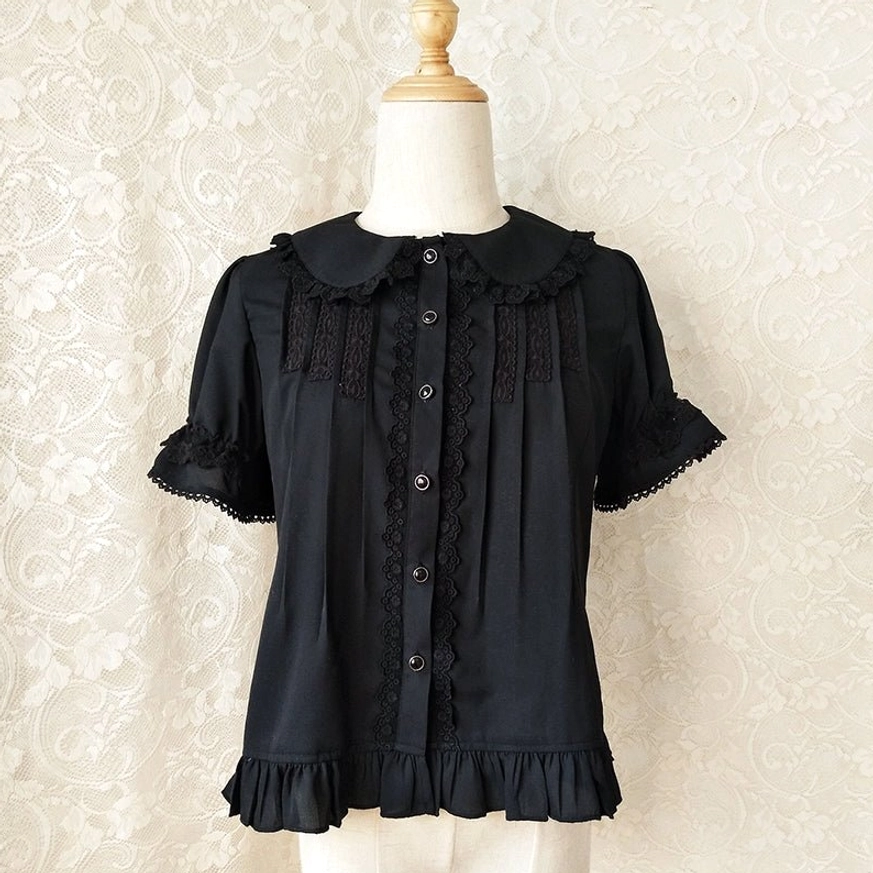 Black short-sleeve sweet lolita Peter Pan collar blouse with black lace trims cuffs and pleated front on dress form showing gothic elegance