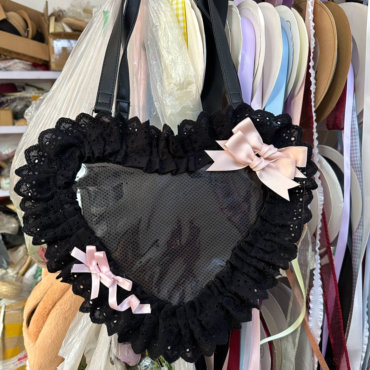 black and pink heart-shaped lolita tote bag with mesh window close-up view ruffled lace trim satin bow decoration