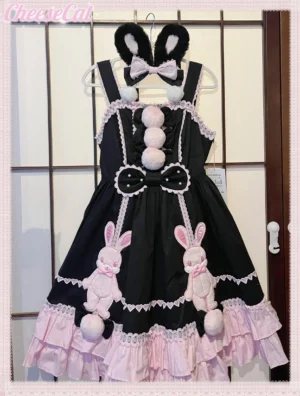 Black and pink bunny themed sweet lolita JSK jumpskirt with lace trims and pompom decorations hanging display