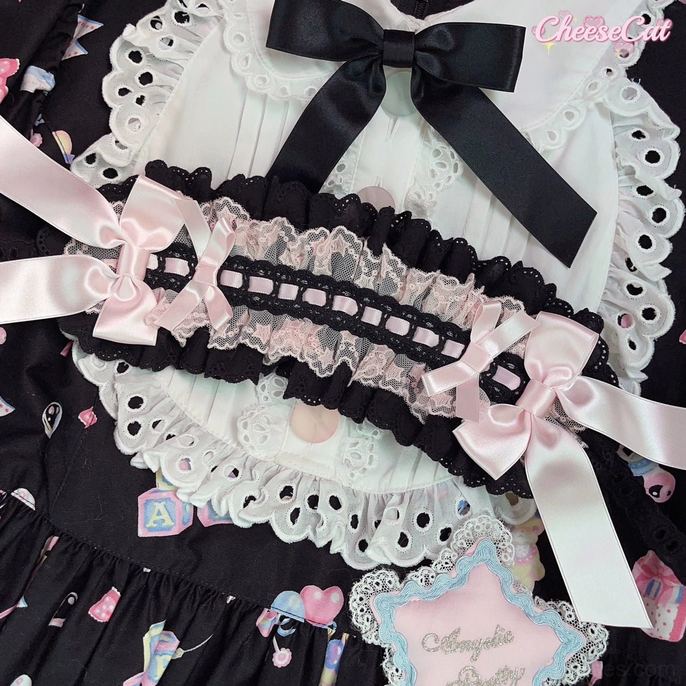 Black and pink sweet Lolita lace headband with light pink satin bow and ruffled edge trim perfect for gothic-sweet aesthetic