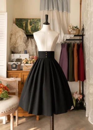 Classic black pleated A-line Lolita midi skirt with decorative buttons and high waistband, frontal display
