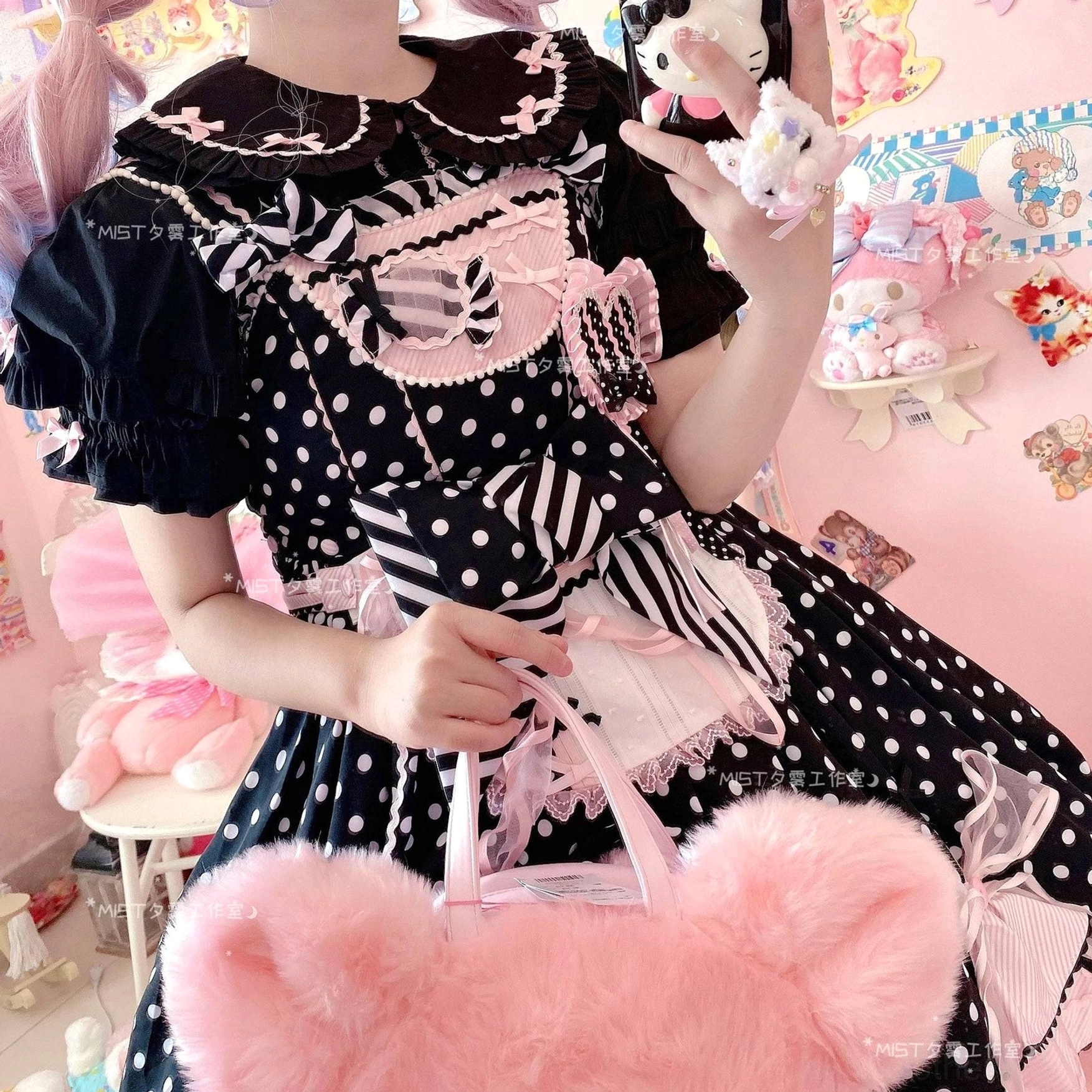Black polka dot lolita dress with puff short sleeves ruffled doll collar patchwork stripe prints and fluffy pink bear handbag accessory model detail