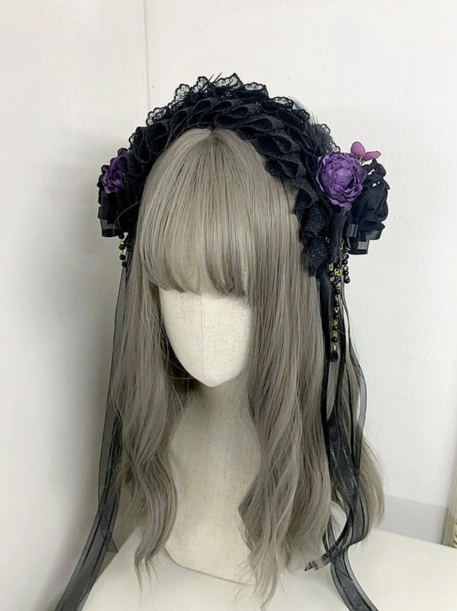 Black and purple gothic lolita lace headdress with purple silk roses ruffled lace beaded satin ribbon tassels full front view mannequin