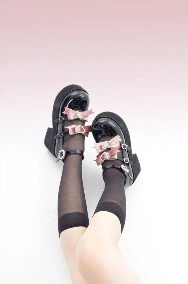 Black purple sweet lolita platform heels front view showing ankle strap closure adjustable lacing system decorative bow accent