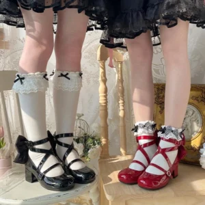 Black and red lolita heel shoes side by side comparison vintage furniture background cross ankle strap design block heel