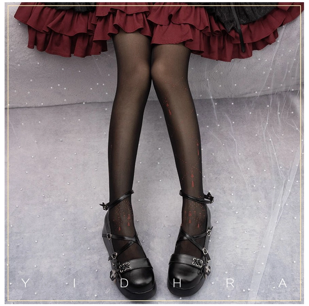 black red song and lights lolita tights with thin red vertical dot decorative prints paired with multi-buckle strap mary jane shoes and burgundy ruffled lolita skirt front view