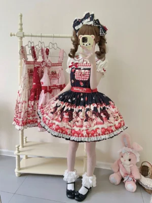 Black-red colorway sweet lolita salopette jumper skirt with gingham chest trims, bear and strawberry motifs, ruffled lace hem, and matching waist bow sash full body view