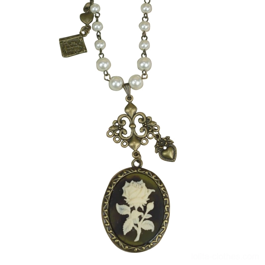 Black oval cameo with white rose motif bronze filigree lolita pearl necklace close-up detail shot jewelry