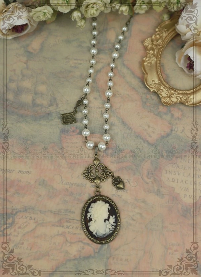 Black rose cameo lolita necklace pearl metal chain bronze filigree vintage jewelry statuette variant flat lay