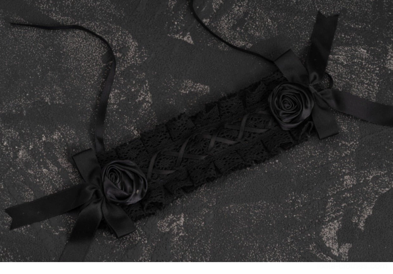 Black rose lolita hairband flat lay overhead view showing lace base satin rose decorations adjustable ribbon straps