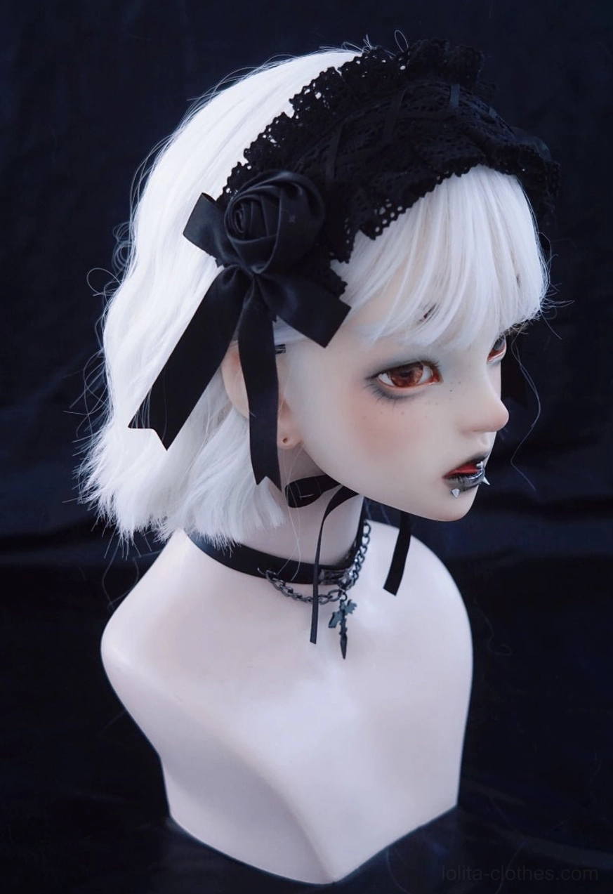 Black rose lolita headdress left side profile view showing 3D satin rose embellishment and ribbon bows on mannequin