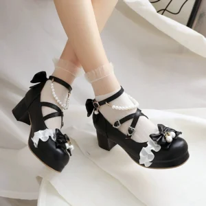 Black round-toe sweet lolita high heel shoes with detachable pearl ankle chain, bow decoration, ruffle flower trim on toe cap, cross buckle straps, and chunky block heel, modeled with frilly ankle socks