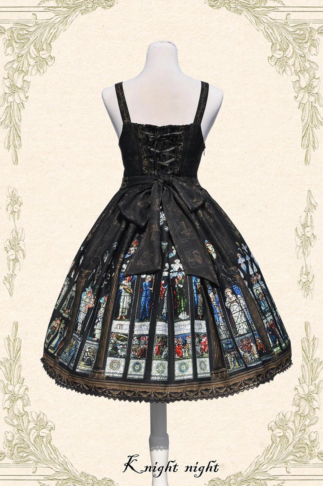 Back view of Black Saint Priest Lolita Jumper Skirt showing large detachable bow, lace-up back design, church stained glass print skirt, and golden hem trim detail