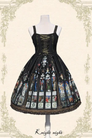Black Saint Priest Lolita JSK with ecclesiastical stained glass print, wide shoulder straps, front lace-up corset design, and dark lace hem trim displayed from front angle