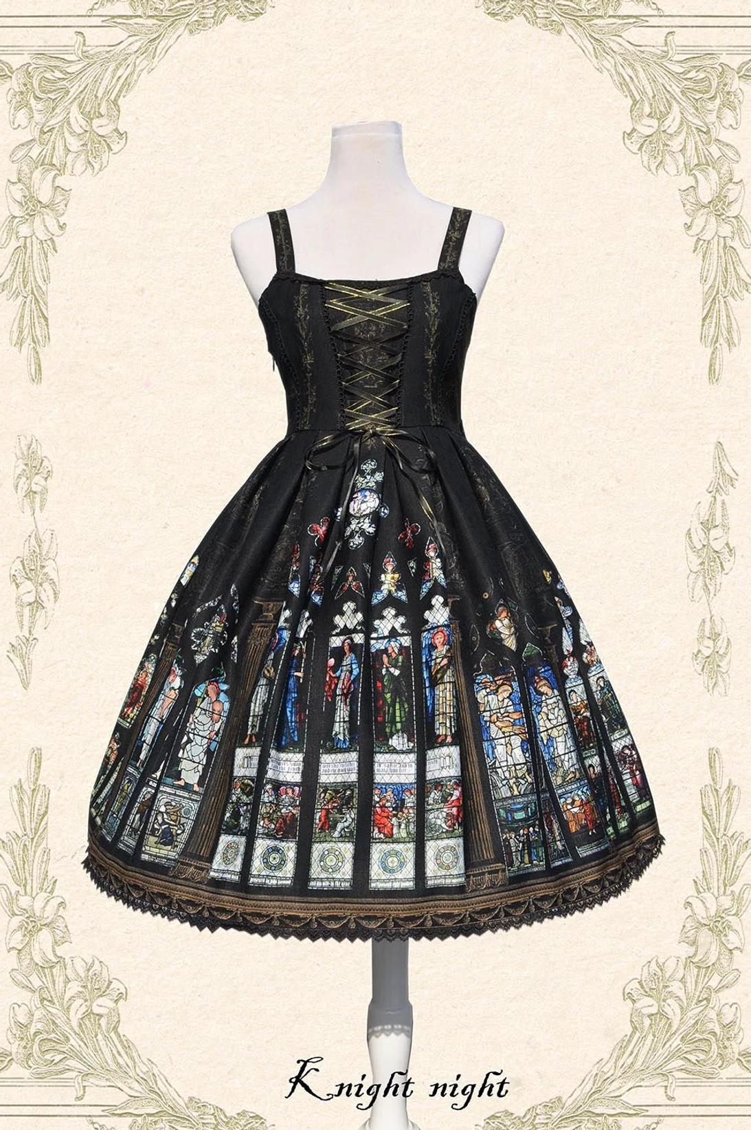 Black Saint Priest Lolita JSK with ecclesiastical stained glass print, wide shoulder straps, front lace-up corset design, and dark lace hem trim displayed from front angle