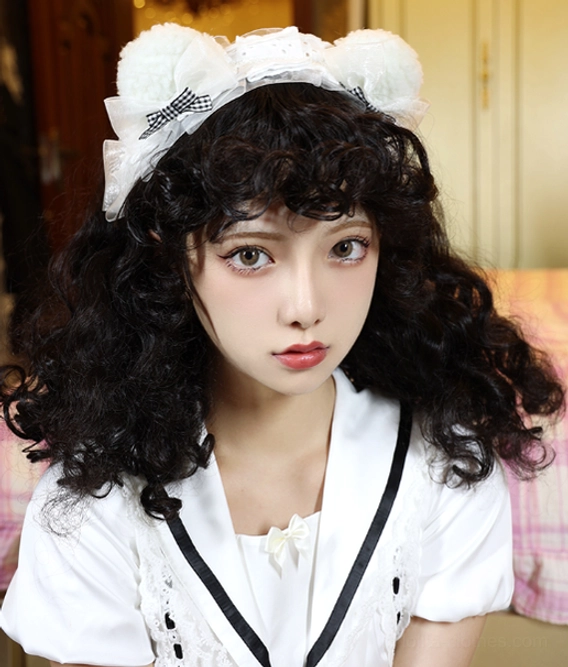 Black short fluffy curly lolita wig with white bear ear headband and bow worn with preppy school lolita top