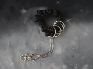 Black gothic hair scrunchie with metal rings and skeleton lobster clasp chain detail